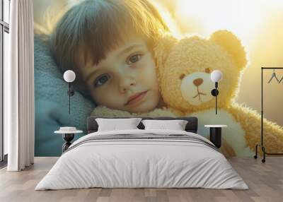 Child with a chronic illness, holding a stuffed animal, symbolizing health problems in children, soft lighting Wall mural