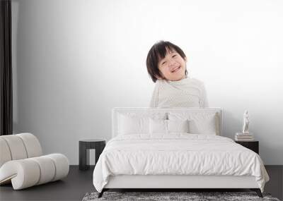 asian boy sitting on white background isolated Wall mural