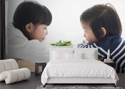 Asian children eating green soybeans Wall mural