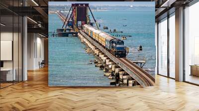 Indian Railways passenger train crossing historical , 2 kms long Pamban sea bridge. Wall mural