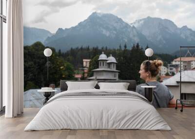 Back view of older women in mountains Wall mural