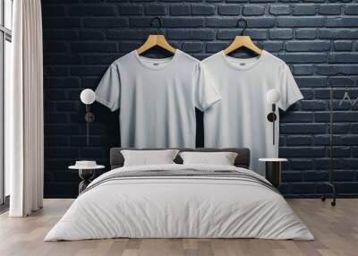 Blank White T shirts Hanging on Hangers Against Brick Wall Wall mural