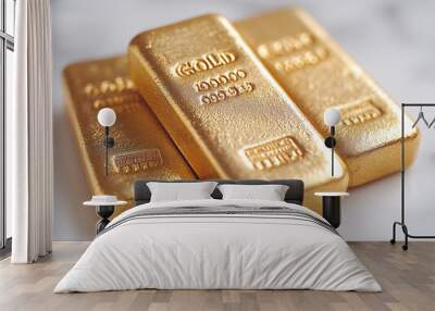 gold bars lying on a white surface. Wall mural