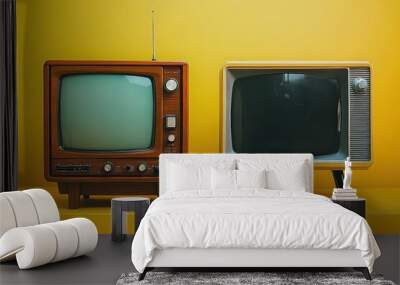  Side-by-side comparison of two retro televisions with a vibrant yellow background. A visual representation of technological progress and design aesthetics in TV history. Wall mural