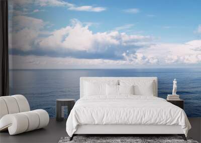 a beautiful blue sea with clouds. background, concept of calm and relaxation , high resolution Wall mural