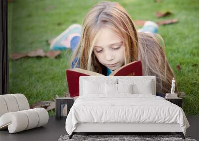 Little Girl Reads Bible Outdoors Wall mural