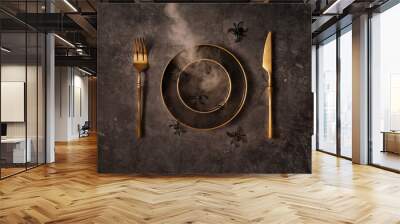 Vintage template with old metal plates, golden cutlery, spiders and smoke on black stone background for Halloween design. Halloween celebration concept. Flat lay style. Wall mural