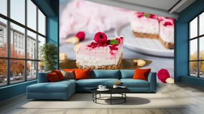 Vegan raw raspberry nut cheesecake on a light  background. Healthy vegan food concept.  Sugar, dairy and gluten free dessert Wall mural