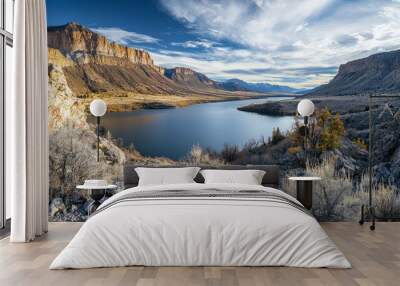 Scenic view of a river valley with mountains under a blue sky Wall mural