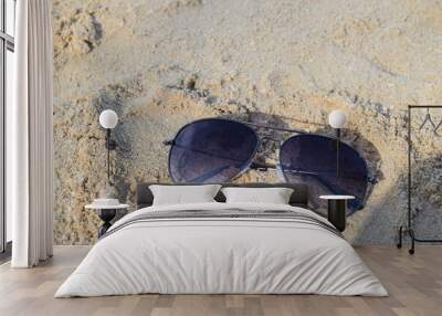 sunglasses on the sand Wall mural