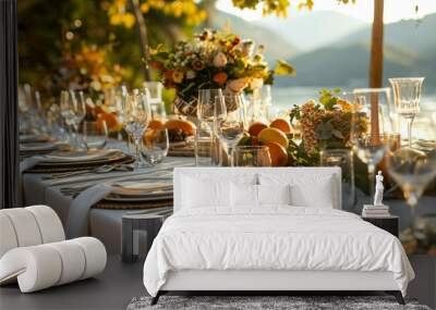 A table with a variety of fruit and flowers, including oranges, apples Wall mural