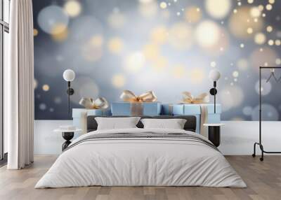 Blue gift boxes with golden ribbon bow tag over blurred bokeh background with lights. Christmas decor. Greeting festive image. Copy space Wall mural