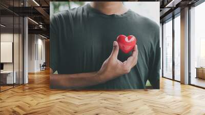 Hand holding red heart, World health day, Health care and mental health concept, Health insurance, Charity volunteer donation, CSR responsibility, World heart day, Self love Wall mural