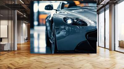 A modern luxury gray sports car parked in a dark environment, showcasing its shiny clean lines and detailed front view, ideal for high-end automotive advertising concepts and stylish imagery Wall mural