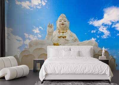 The goddess of compassion and mercy Statue with blue sky at Chaing rai, Thailand, religion concept. Wall mural