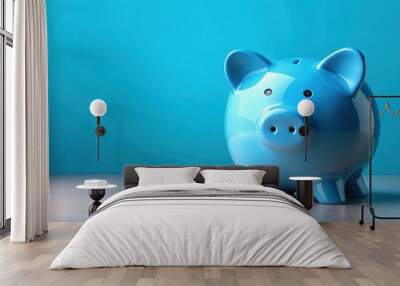 Blue piggy bank standing alone on a blue background, piggy bank, savings, finance, money, blue, isolated Wall mural