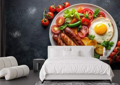 Plate of delicious breakfast with sausage, eggs, tomatoes, and assorted vegetables on black background, breakfast, sausage Wall mural