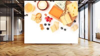 Cheese, a flat lay overhead shot on a white background with copy space. Blue cheese, Leicester, Emmental, and others sorts with wine, fruits, nuts, and a place for text Wall mural