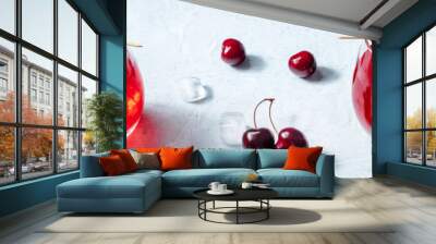 Cocktail with a cherry panorama. Alcohol drink with ice and berries panoramic banner with two glasses Wall mural