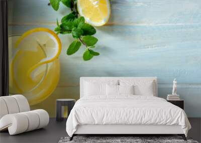 Lemonade panorama with copy space. Homemade fresh lemon beverage, shot from above on a wooden background with a place for text. Healthy organic detox panoramic banner Wall mural