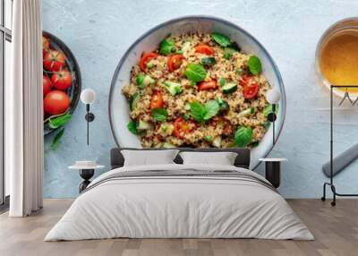 Quinoa tabbouleh salad in a bowl panorama, a healthy dinner with tomatoes and mint, overhead flat lay shot with a drink Wall mural