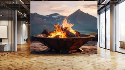 A fire pit with a mountain in the background Wall mural