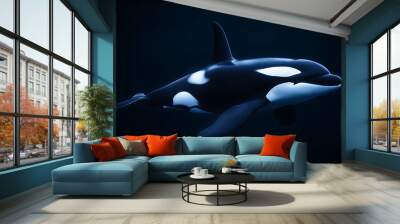 A lone orca swims through the dark blue water, its white patches glowing slightly in the darkness. Wall mural