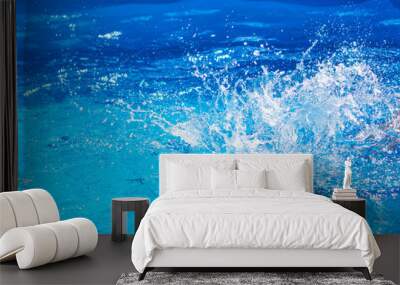 Splashes of clear blue fresh water in pool, air bubbles, water drops, sea wave on blue background with sunny reflections. Wall mural