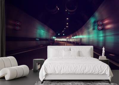 Blurry car tunnel with lights, motion blur background, left turn Wall mural