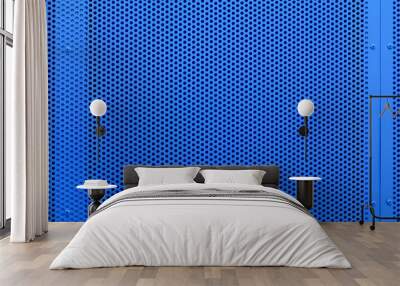 Blue color metal plate with many small circular holes dots texture for background. Facing of buildings and structures perforated metal siding. Lightweight design for space separation. Wall mural