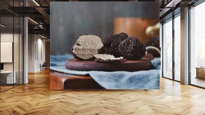 Black truffles  mushrooms on rustic wooden table with free text space . Selective focus. Wall mural