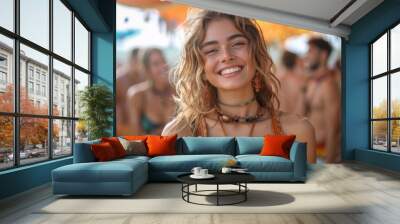 A carefree young woman with a radiant smile at a vibrant beach party scene Wall mural