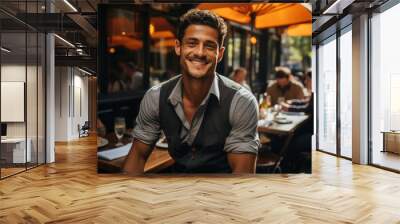 Cheerful white man in grey elegant combination sitting in restaurant garden Wall mural