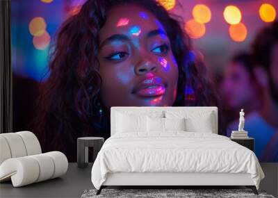 Stunning woman with striking features and colorful lights casting a vivid pattern on her face Wall mural