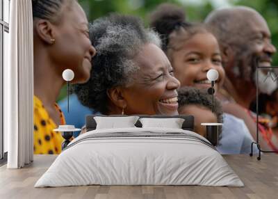 Black family smiling together at a celebration. Wall mural