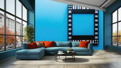 Film reel frame on blue background Wall mural