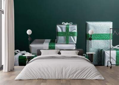 Green and white gift boxes, festive glitter, New Year concept. Wall mural