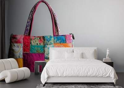 Multicolored patchwork tote bag on neutral background Wall mural