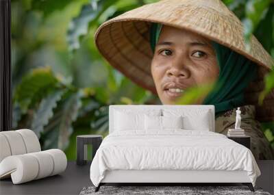 Warm smile of woman in traditional hat among green leaves Wall mural