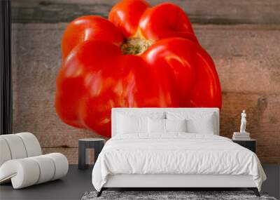 Close-up of fresh ripe tomato on wooden background Wall mural