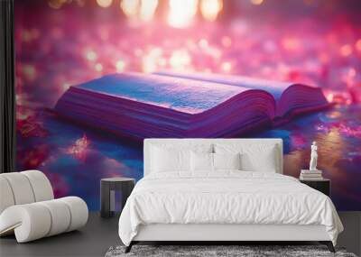 A book is open on a body of water with a pinkish glow Wall mural