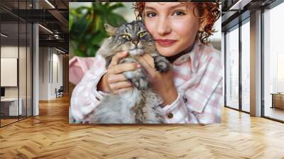 portrait of red-haired attractive young woman with grey big cat Wall mural