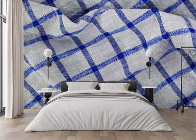 Folded checkered napkin. Blue and white checkered tablecloth. Wall mural