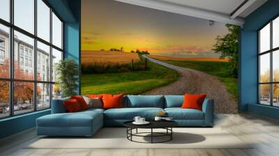 Country Road  moves into the sunset through a cornfield, in the summer time  Wall mural