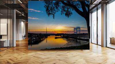 View of a beautiful sunset in the background of Mare Island seen from the Vallejo, Ca. marina  Wall mural