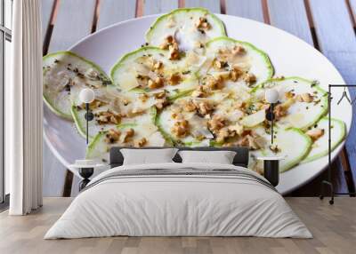 Zucchini carpaccio with walnuts, parmesan and basil Wall mural