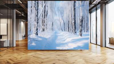 Snow-covered trees on both sides of the road in a winter forest on a sunny day Wall mural