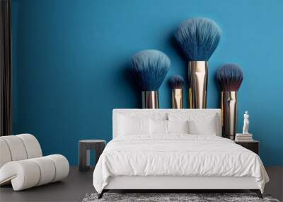 Soft natural brushes for makeup application on blue background with copy space Wall mural