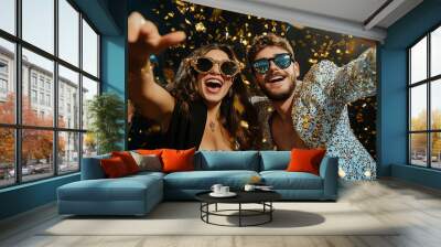 man and woman are smiling and posing for a picture in a gold-covered room. The man is wearing a gold jacket and the woman is wearing sunglasses. Scene is happy and celebratory Wall mural