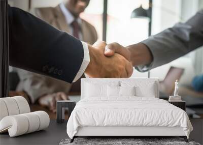 Two men shaking hands in a business meeting. Scene is professional and formal. The handshake symbolizes agreement and trust between the two men Wall mural